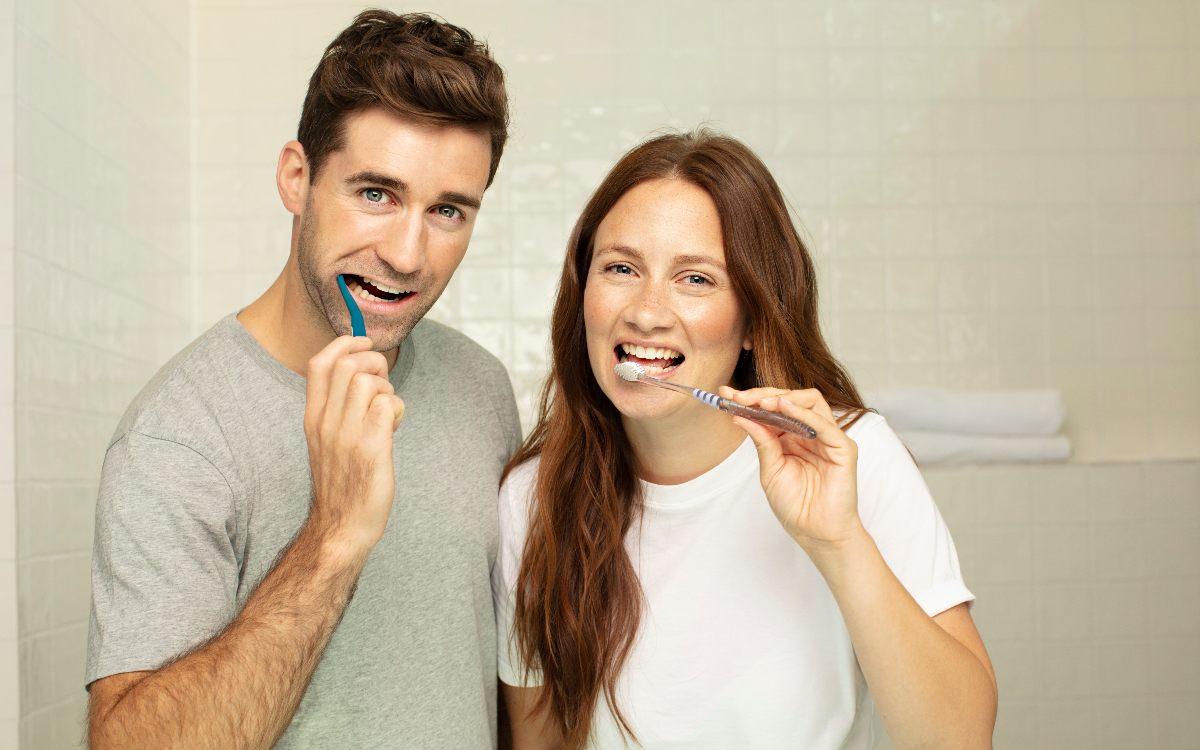 Man and woman with toothbrush