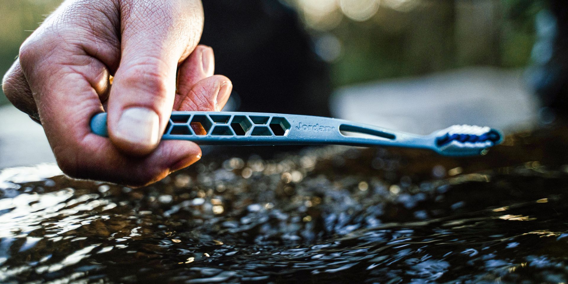 ultralite toothbrush in a stream